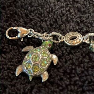 Brighton Turtle charm bracelet.  Gently used.  Silver with green gem stones.